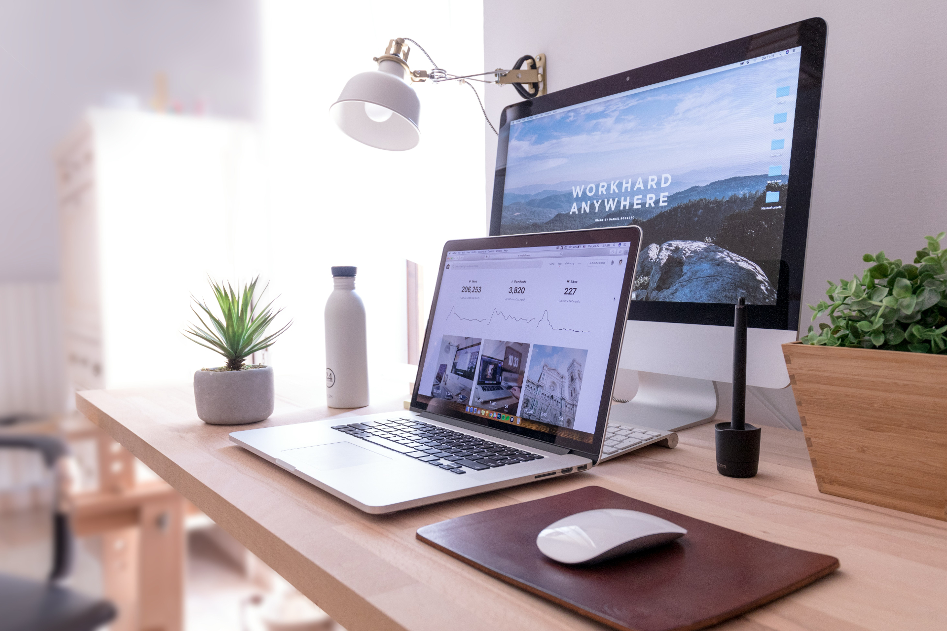 A workspace with a laptop showing a website design